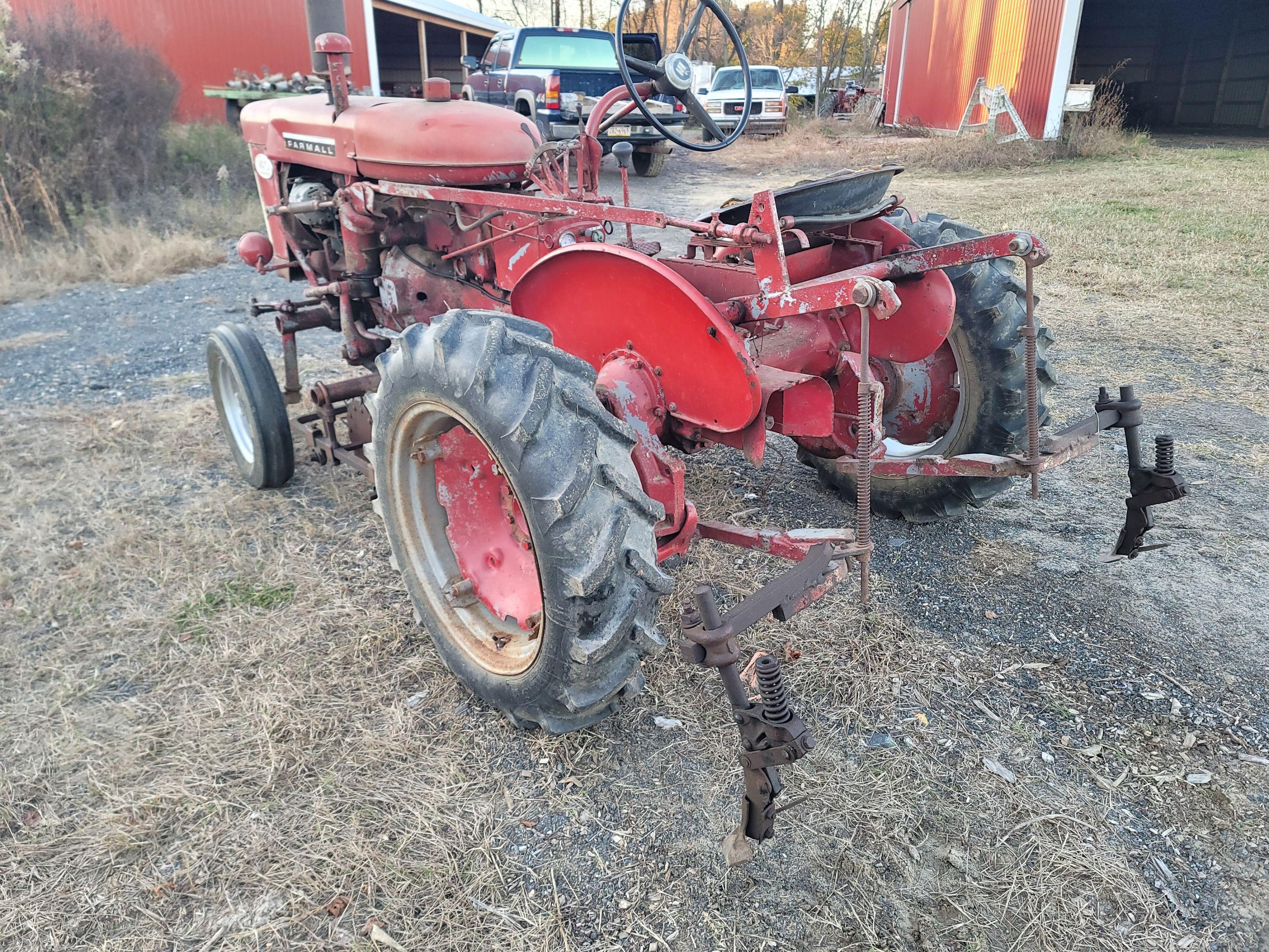 Farmall 140 with rolling basket and rear gang