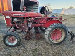 Farmall 140 with rolling basket and rear gang