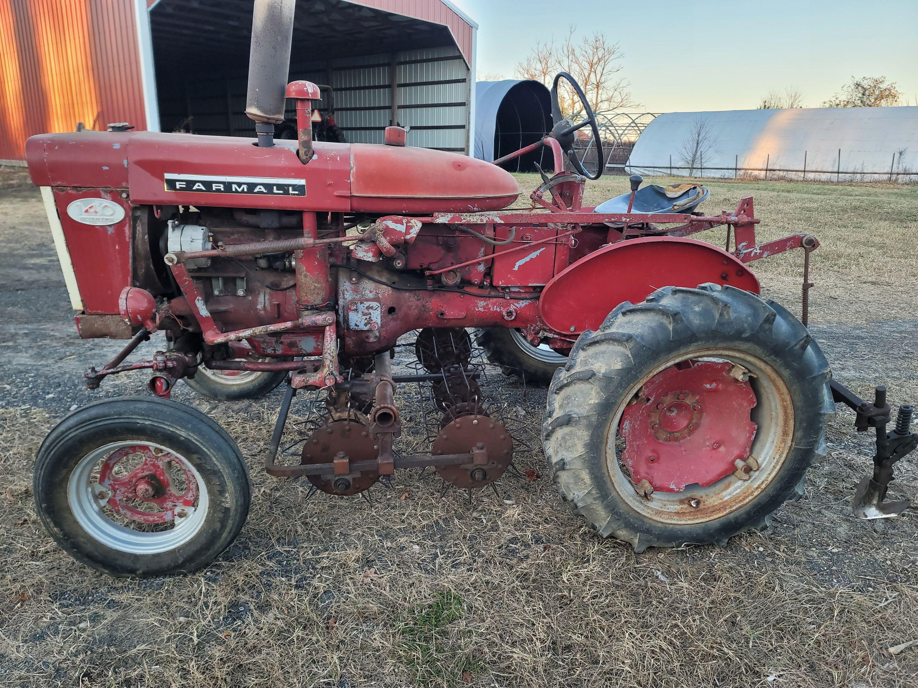 Farmall 140 with rolling basket and rear gang