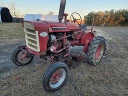 Farmall 140 with rolling basket and rear gang
