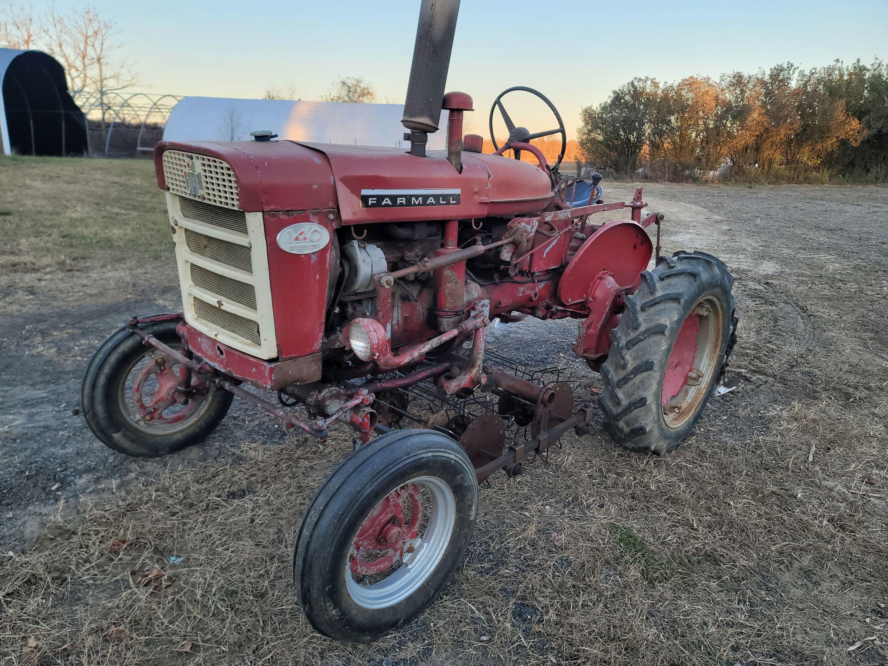 Farmall 140 with rolling basket and rear gang