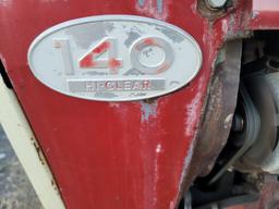 Farmall 140 with rolling basket and rear gang
