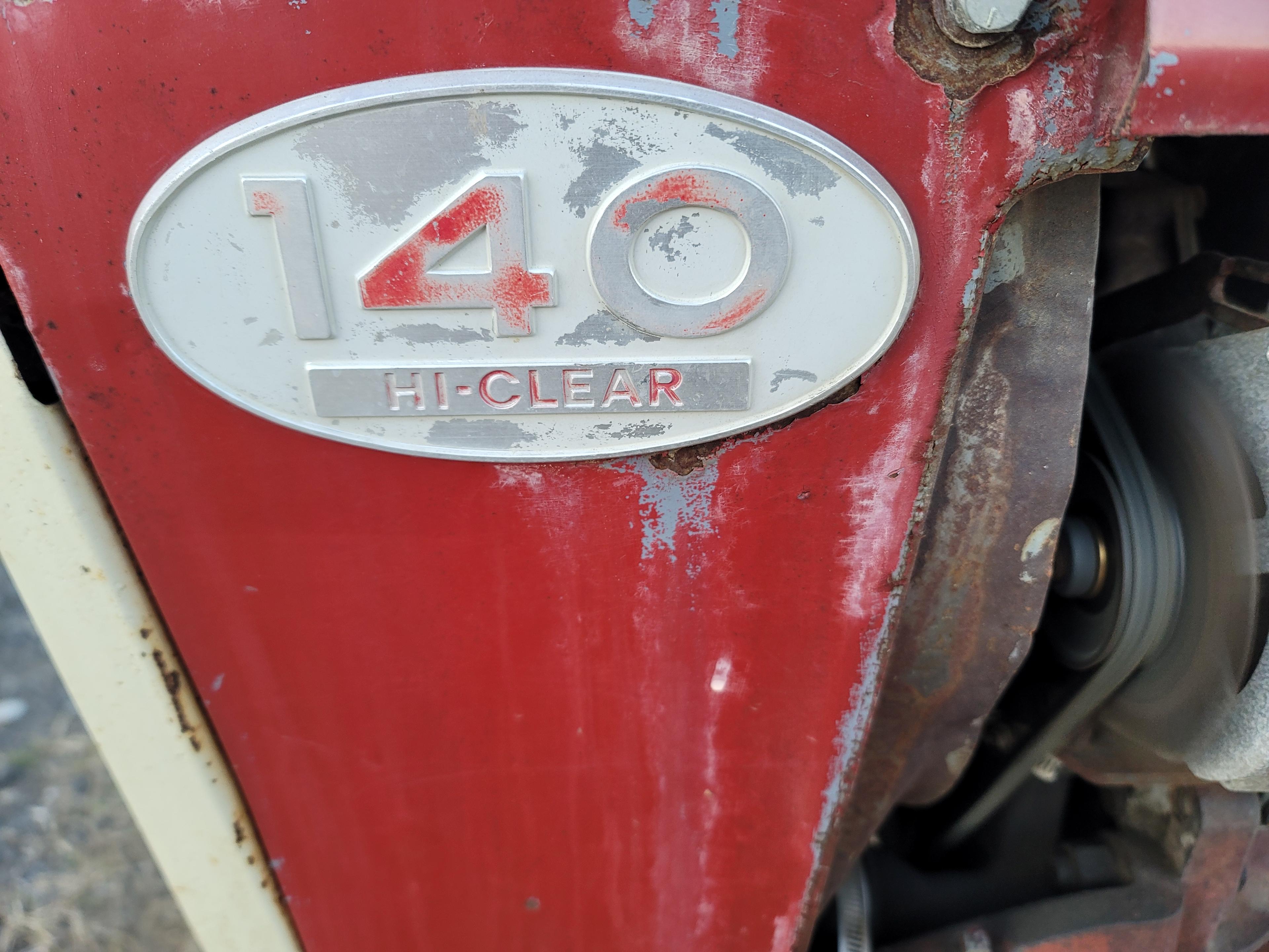 Farmall 140 with rolling basket and rear gang
