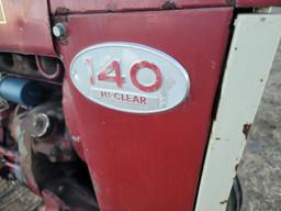 Farmall 140 with rolling basket and rear gang