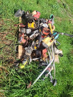 pallet of parts weedeaters and chainsaws