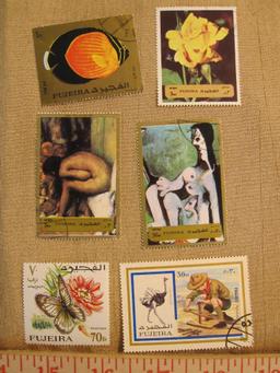 Lot of 12 postage stamps, all but one canceled, from Fujeira, one of the seven emirates that make up