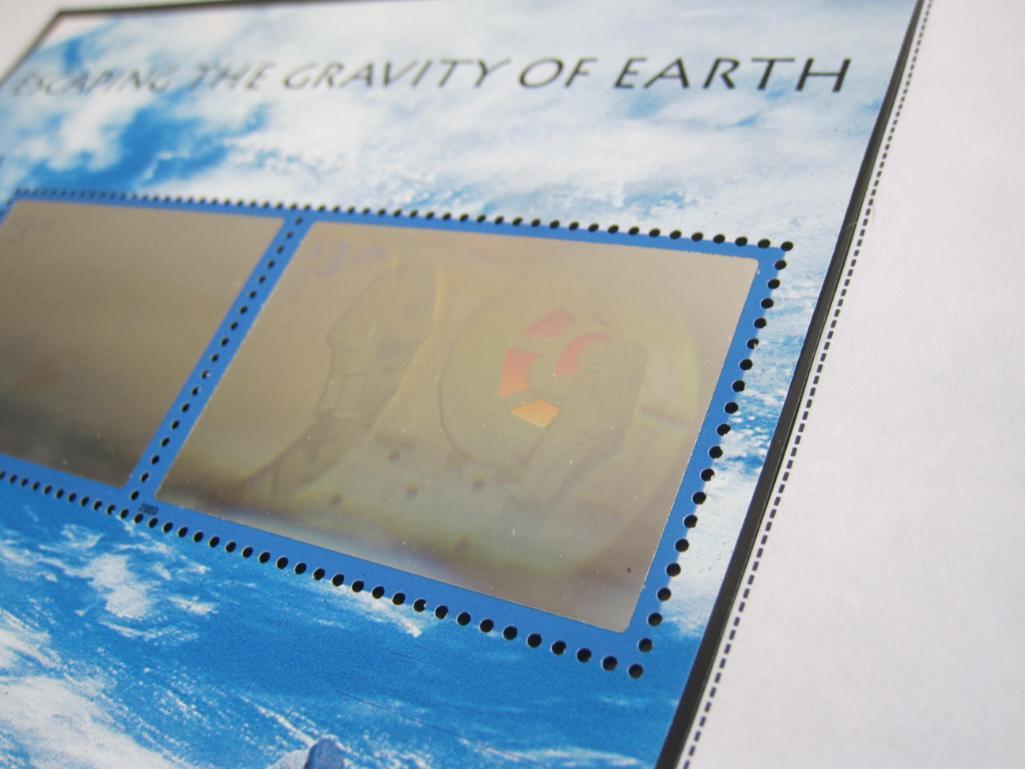 An official Scott album page, "Escaping the Gravity of Earth," with 2 2000 hologram $3.20 US postage