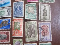 Mixed lot of more than TWO DOZEN foreign postage stamps from Ethiopia, British Honduras and Belgian