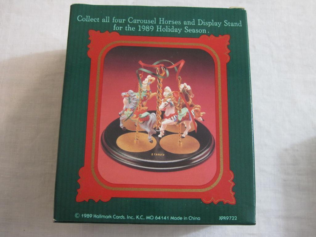 Lot of Carousel Horses Hallmark Ornaments including Snow, Holly, Star, Ginger, and 2 Display Stands,
