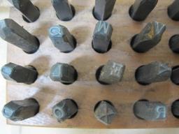 Set of Steel Punches in wooden block, No 6792 1/8 inch Letters