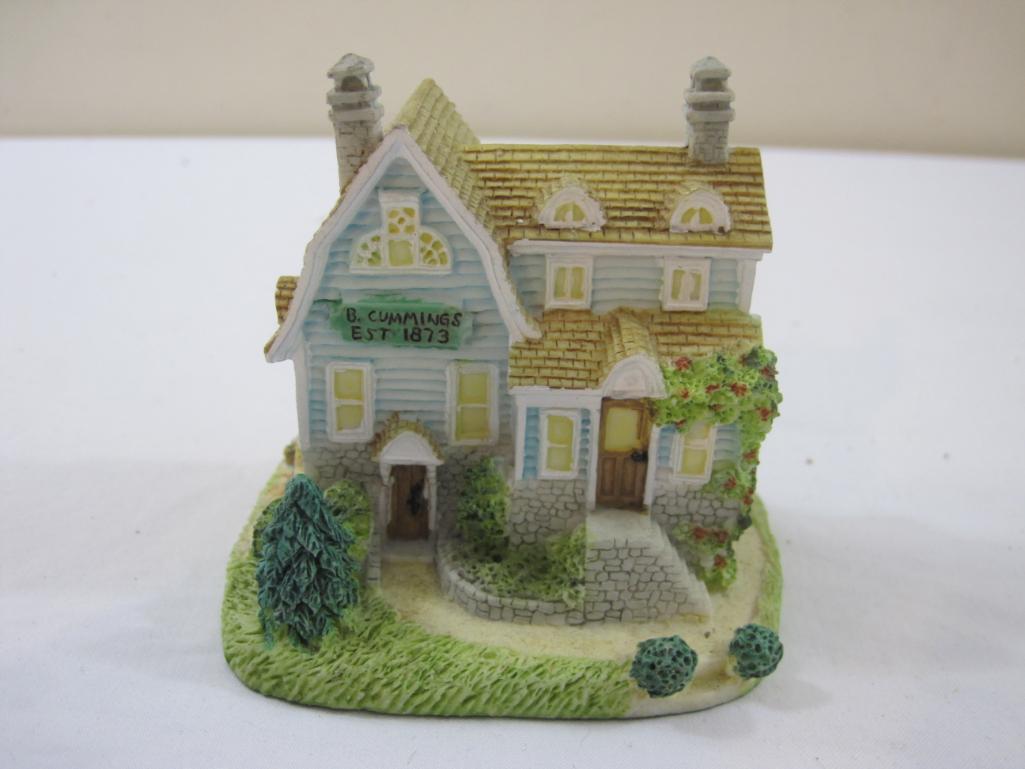 Two Miniature Houses including ceramic ornament and resin B Cummings Signmaker house, 13 oz