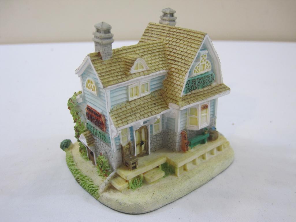 Two Miniature Houses including ceramic ornament and resin B Cummings Signmaker house, 13 oz