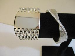 Two Silver Tone Bracelets including clamshell with rhinestones, 4 oz