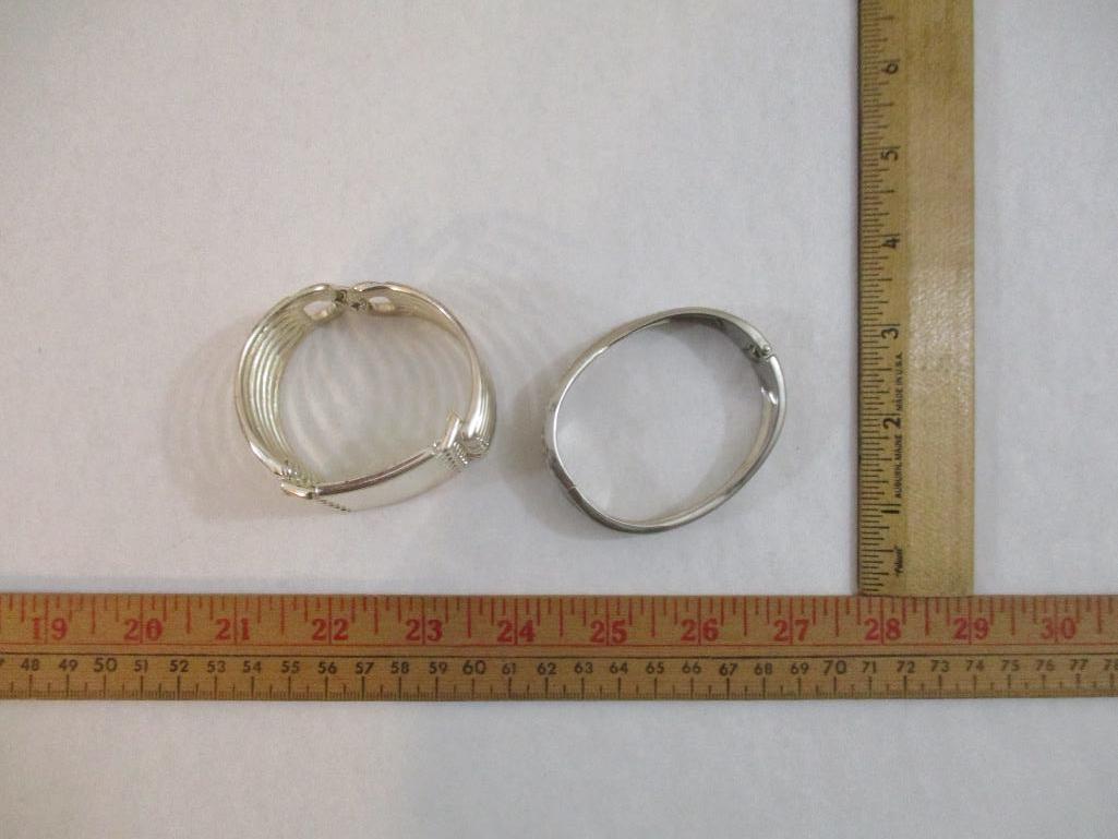 Two Silver Tone Bracelets including clamshell with rhinestones, 4 oz