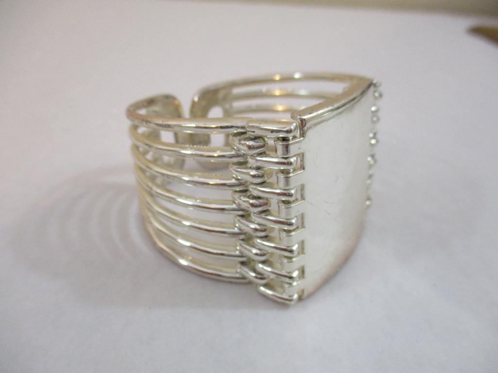 Two Silver Tone Bracelets including clamshell with rhinestones, 4 oz