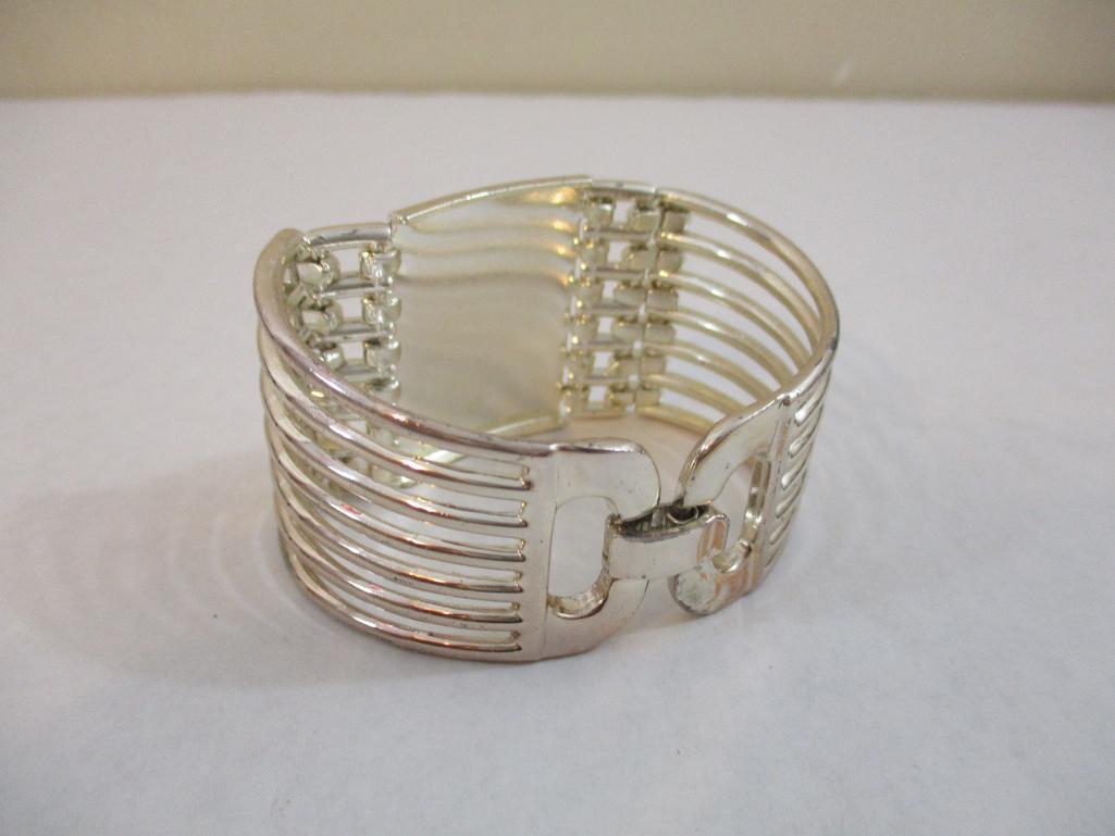 Two Silver Tone Bracelets including clamshell with rhinestones, 4 oz