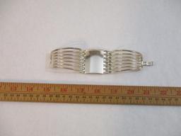 Two Silver Tone Bracelets including clamshell with rhinestones, 4 oz