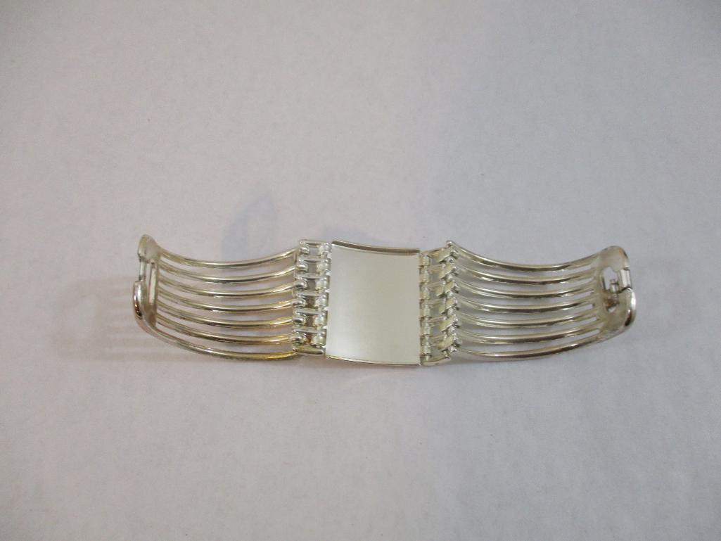 Two Silver Tone Bracelets including clamshell with rhinestones, 4 oz
