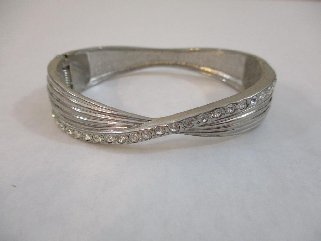 Two Silver Tone Bracelets including clamshell with rhinestones, 4 oz