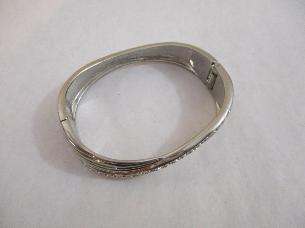 Two Silver Tone Bracelets including clamshell with rhinestones, 4 oz