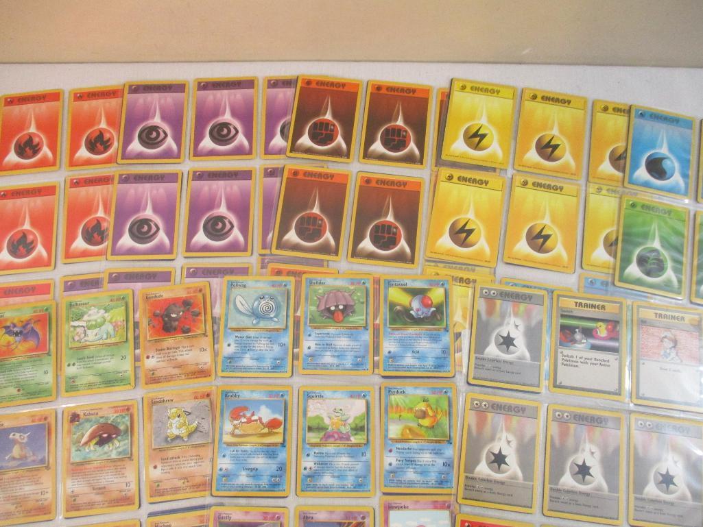 Seven Sheets of Pokemon Cards, 1999 Wizards including Paras, Grimer, Charmander, Trainers and