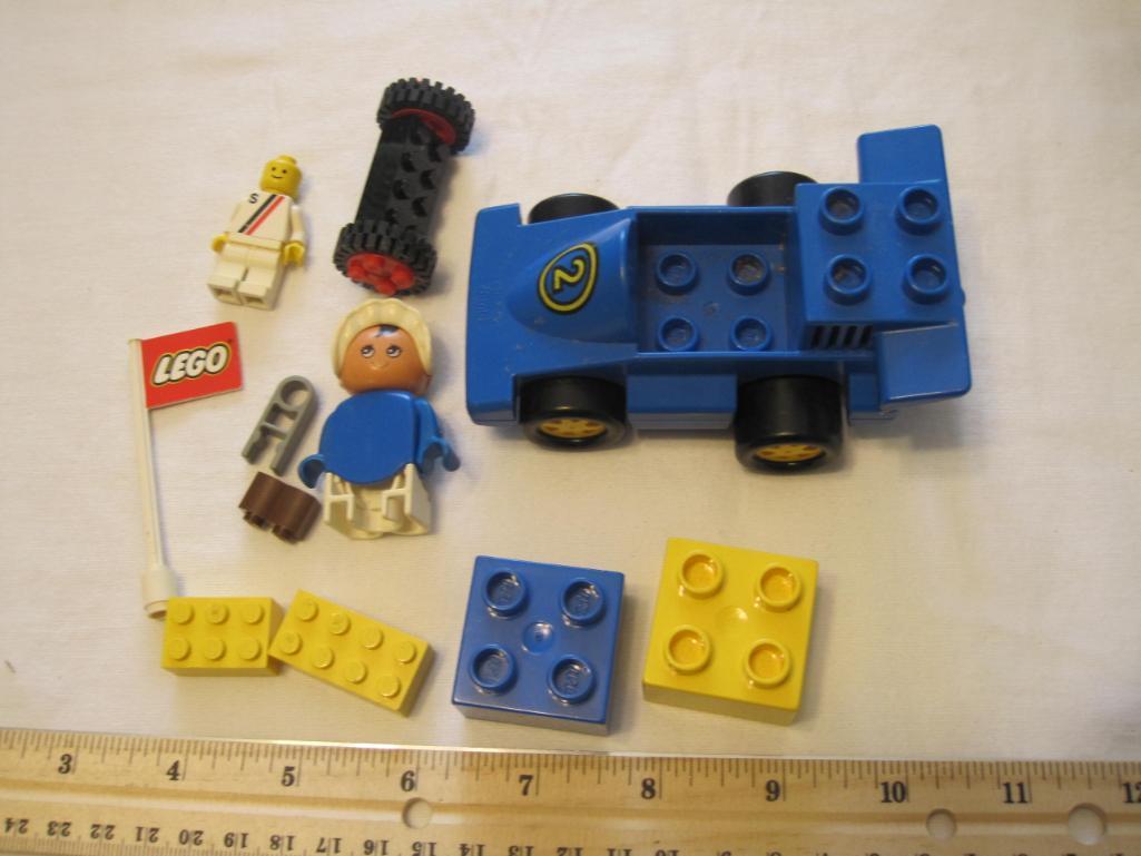 Assorted Lego Pieces including racecar, flag, figures and blocks, 4 oz