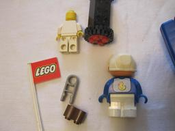 Assorted Lego Pieces including racecar, flag, figures and blocks, 4 oz