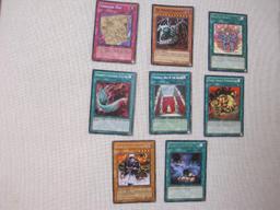 Assorted Yu-Gi-Oh Trading Cards including foil The Wicked Dreadroot, foil Treasure Map, foil