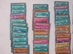 Assorted Yu-Gi-Oh Trading Cards including foil The Wicked Dreadroot, foil Treasure Map, foil