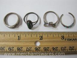 Four Silver Rings, one marked and has missing stones, others unmarked