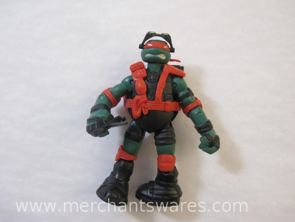 Four Teenage Mutant Ninja Turtles including 2013 Stealth Tech Raphael, 2012 Hand to Hand Ooze