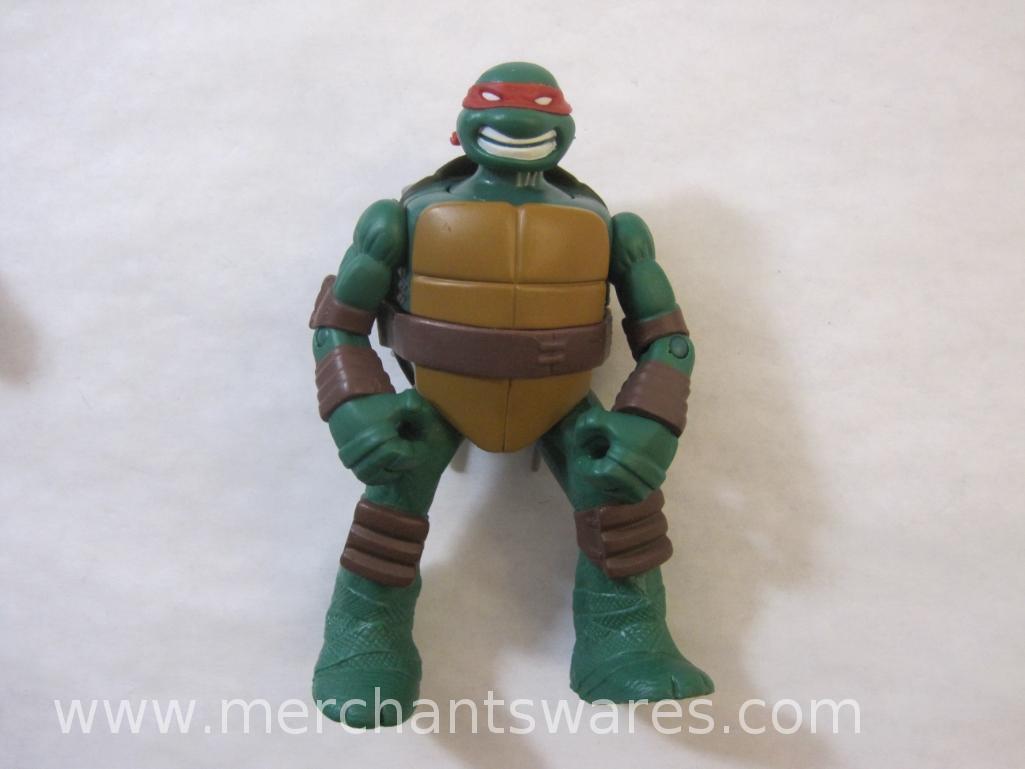 Four Teenage Mutant Ninja Turtles including 2013 Stealth Tech Raphael, 2012 Hand to Hand Ooze