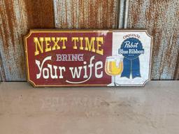 "NEXT TIME BRING YOUR WIFE" SIGN