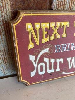 "NEXT TIME BRING YOUR WIFE" SIGN