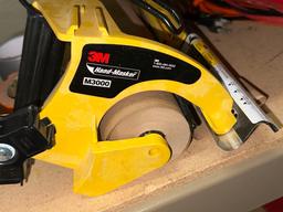 Box full of Tape and Hand Masker Dispenser