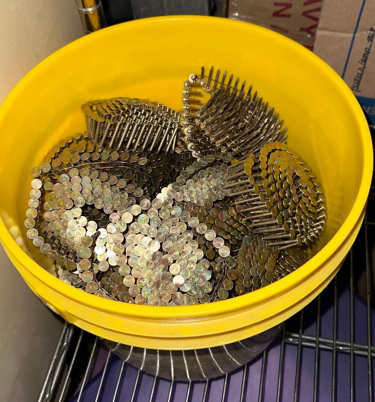 Bucket of New Coils of Roofing Nails
