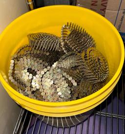 Bucket of New Coils of Roofing Nails