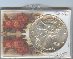 1990 AMERICAN SILVER EAGLE IN CUSTOM HOLDER