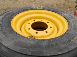 (4) New 12-16.5 Tires on Cat Rims (4x Bid Price)