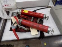 (2) Red Grease Guns with a Group of Adapters