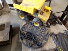 Black Cast Iron Medallion Wall Decoration and a Steel Bodied Tonka Truck, B