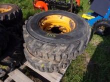 (2) Used 12-16.5 10 Ply Skid Steer Tires on 8 Lug Wheels