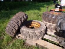 (2) Used Carlisle 10-16.5 10 Ply Skid Steer Tires on 8 Lug Rims and (2) Gal