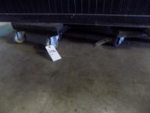 (2) Wooden 4 Wheeled Dollies Under Display Cabinet