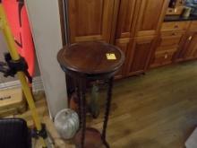 Small Round Accent Table and Group of Large Decorations