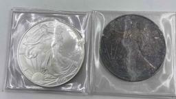 1986 & 2006 Uncirculated US Silver Eagle. 1986 is in original box.