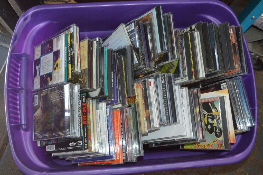 100'S OF MIXED MUSIC CD'S IN PURPLE BIN
