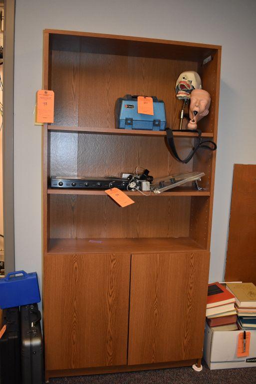 BROWN WOODEN SHELVING UNIT WITH TWO DOORS AND THREE SHELVES,