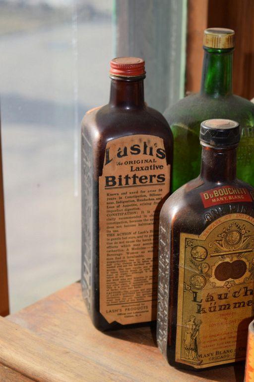 VINTAGE GLASS BOTTLES, TINS AND FLASK
