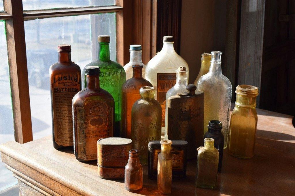 VINTAGE GLASS BOTTLES, TINS AND FLASK